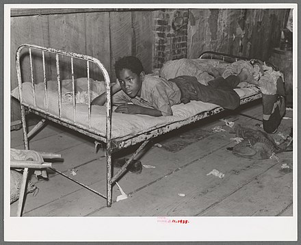 African American boy in a sharecropper shack, New Madrid County, 1938.