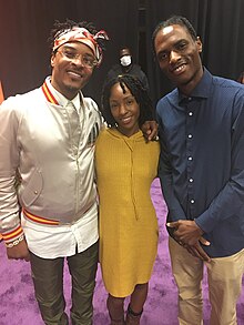 American Rapper T.I. with Brittany Chrishawn Moore and her husband Ausar Moore backstage in Jacksonville, FL (Oct. 2021)