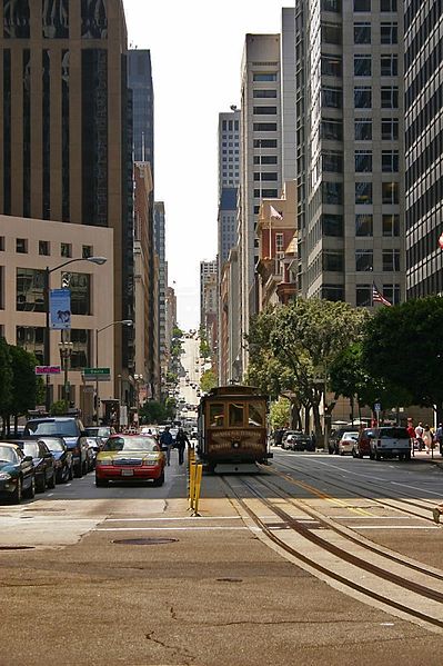 A San Francisco cable car travels along California Street in the city's Financial District.