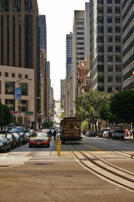 A San Francisco cable car travels along California Street in the city's Financial District.