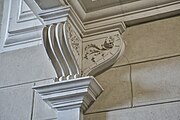 Doric capital and consoles with seed pods at the Château de Castelnau-d'Estrétefonds.