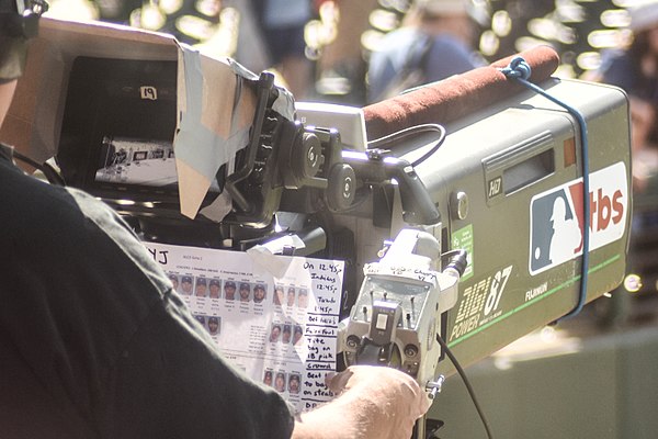 A TBS camera used for Game 2 of the 2016 ALCS. Visible are notes for the camera operator and thumbnail photographs of each player in the game.