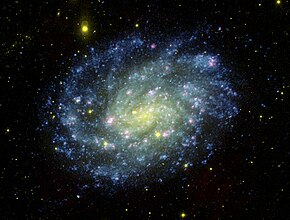 Spirální galaxie NGC 300 na ultrafialovém snímku z teleskopu GALEX. Autor: NASA.