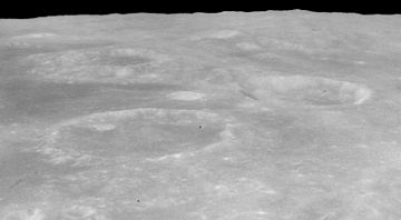 Oblique view of Cook crater (below left of center) and Monge crater (above right of center), facing south, from Apollo 16 Cook crater Monge crater AS16-M-0677.jpg