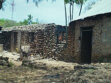 Most homes in Shimoni are built with mined coral from around the area Coral Rag Houses.JPG