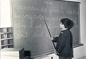 Crown Prince Reza Pahlavi in school.jpg