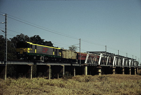 QR electric loco 3903 hauling a special train crosses the Nogoa River bridge, east of Emerald, September 1989