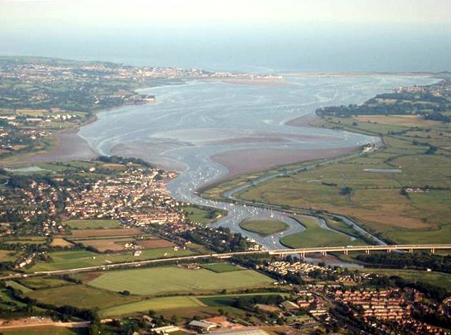 The Exe Estuary from a balloon over Exeter. The M5 motorway is in the foreground, Topsham on the left bank just beyond, and Exmouth at the river mouth