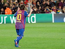 Messi pointing to the sky following his record five-goal display against Bayer Leverkusen in the last 16 of the UEFA Champions League in 2012 FC Barcelona - Bayer 04 Leverkusen, 7 mar 2012 (07).jpg