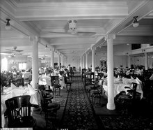 Part of Orama's first class dining saloon in 1911, with fluted Ionic columns First Class Dining Saloon on the 'Orama' (1911) RMG G10659.tiff