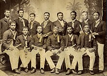 Charles E. King (standing second from right) with the first graduating class of the Kamehameha School for Boys, 1891