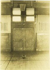 The original 1891 "Basket Ball" court in Springfield College. It used a peach basket attached to the wall. Firstbasketball.jpg