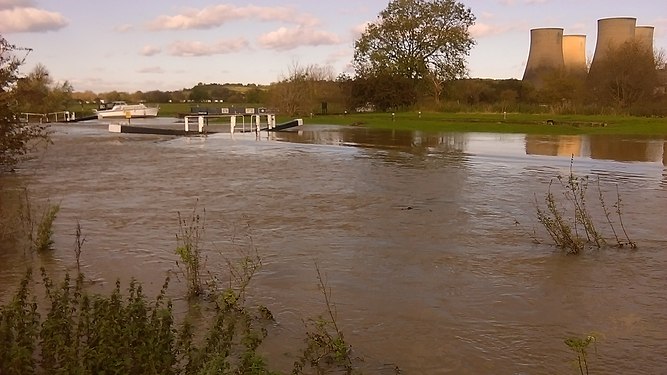 Canal lock overwhelmed by floodwaters from the River Soar, Leicestershire after heavy rain