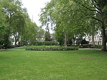 View along the public gardens and the church in the same square, in the background. Gardens in St George's Square, Pimlico - geograph.org.uk - 1300142.jpg