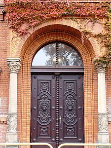 Main gate adorned with lions' heads