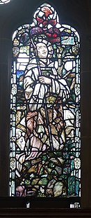 Stained glass window in Glasgow Bute Hall depicting Saint Kentigern, who supposedly led the Scots to divine victory over the Islemen GlasgowButeHallStKentigern.jpg