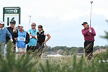 Norman tees off in windy conditions at the 2008 Open Championship at Royal Birkdale. Greg Norman, Open 2008.jpg