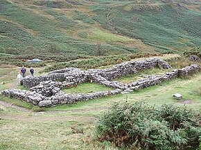The Roman bath house at Hardknott, outside and below the fort perimeter to the southwest. The car shows the proximity of the modern road. Hardknott Castle Roman Fort - Bathhouse - geograph.org.uk - 546609.jpg