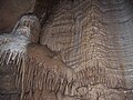 Image 43A flowstone formation inside Chimney Dome, part of Illinois Caverns in Monroe County. The cave is formed in limestone and dolomite by water dissolution and features stalactites, stalagmites, rimstone dams, flowstone, and soda straws. Photo credit: A. Frierdich (from Portal:Illinois/Selected picture)