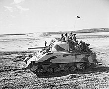 Indian Armoured Corps in a Sherman III tank in the Middle East, March 1944. Indian Armoured Corps in the Middle East 1944.jpg