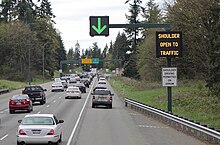 Sign-controlled peak shoulder lane on Interstate 405 near Seattle, Washington, U.S. Interstate 405 northbound shoulder bypass near Bothell, WA.jpg