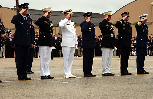 Members of the Joint Chiefs of Staff render a salute during the departure ceremony at Andrews Air Force Base for former President Ronald Reagan, June 11, 2004.