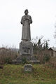 Centrální socha mistra Jana Husa na pomníku padlým během první světové války umístěném v Krauzovně, části obce Kly.