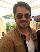 Luis Fonsi spent eleven non-consecutive weeks at number one in 2017 with "Despacito", the longest-running foreign language number one in UK chart history. Luis Fonsi 2015 (cropped).JPG