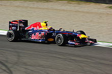 Mark Webber suffered Red Bull's first retirement of 2011 when he attempted to take his car back to the pits following a collision with Felipe Massa. M Webber 2 Monza 2011.jpg