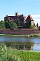 *Nomination River View of St Mary's Church, High Castle of the Teutonic Order in Malbork (Lightened Shadows!) --Scotch Mist 06:34, 28 April 2024 (UTC) * Discussion IMHO, it is better with the darker shadows. --C messier 16:20, 5 May 2024 (UTC) Another perspective? --Scotch Mist 13:32, 6 May 2024 (UTC)