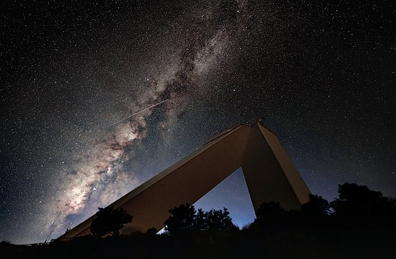 This photo, taken in 2018, shows the McMath-Pierce Solar Telescope building set against the backdrop of the Milky Way and a meteor (or shooting star) streaking across the sky. [12]