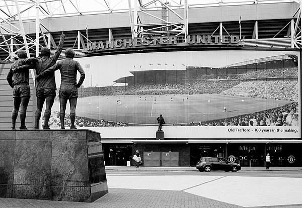 Old Trafford's East Stand in 2011, displaying a panorama of the stadium over the course of 100 years