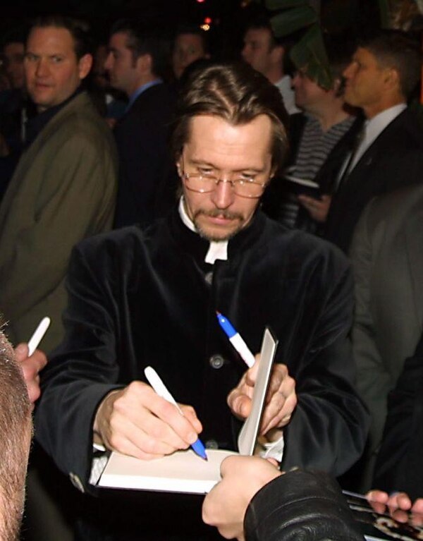 Oldman signing autographs for fans in 2007