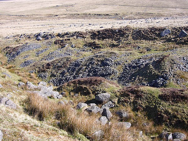 An example of the characteristic pattern of parallel ridges and scarp left by tin-streaming, east of Fox Tor, Dartmoor Open tinners workings Fox tor 2.jpg