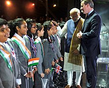 Indian Prime Minister Narendra Modi meets British Indian children in London in 2015 PM Modi at Wembley 4.jpg