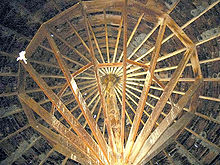 Interior ceiling of Pete French Round Barn shows the large single juniper center post and dimentonal wood lumber support structure Pete French Round Barn interior EncMstr.jpeg