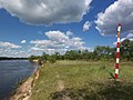 River bank and a sign for ships - panoramio.jpg
