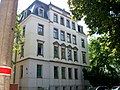 Tenement house with enclosure in open development