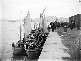 A selection of boats from a Royal Navy squadron in 1909 This demonstrates the continued extensive use of boats propelled by oar and sail at a time when all the warships used steam. The funnel of just one steam pinnace can be seen in the picture, and there may be one other just visible. Sailors of HMS King Edward VII....jpg