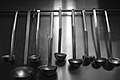 Set of serving ladles on stainless kitchen wall.jpg