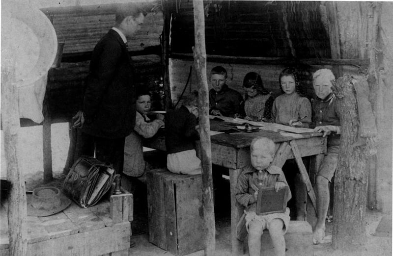 File:StateLibQld 2 149763 Teacher and class at a bush school, 1910-1914.jpg