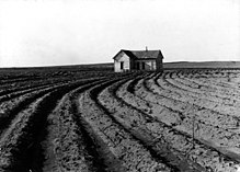Power farming displaces tenants from the land in the western dry cotton area. Childress County, Texas, 1938 Tenantless farm Texas panhandle 1938.jpg
