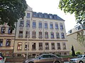 Apartment building in semi-open development with a front garden