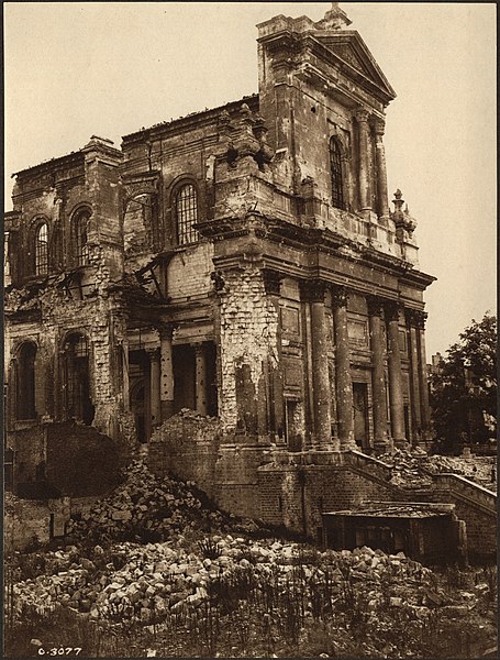 The main entrance to the Arras Cathedral showing the roof completely blown off and the steps covered with fallen masonry, [ca. 1918]