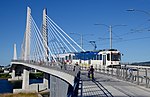 A two-car Orange Line train on Tilikum Crossing in 2016