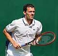 James McGee competing in the first round of the 2015 Wimbledon Qualifying Tournament at the Bank of England Sports Grounds in Roehampton, England. The winners of three rounds of competition qualify for the main draw of Wimbledon the following week.