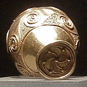 Triskelion and spirals on a Galician torc terminal.