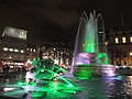 The Trafalgar Square fountain, Westminster (borough), London, seen illuminated at night in December 2011.