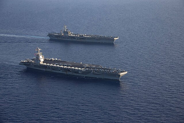 https://upload.wikimedia.org/wikipedia/commons/thumb/f/f8/USS_Gerald_R._Ford_%28CVN-78%29_and_USS_Dwight_D._Eisenhower_%28CVN-69%29_underway_in_the_Mediterranean_Sea%2C_3_November_2023_%28231103-N-HJ055-1005%29.JPG/640px-USS_Gerald_R._Ford_%28CVN-78%29_and_USS_Dwight_D._Eisenhower_%28CVN-69%29_underway_in_the_Mediterranean_Sea%2C_3_November_2023_%28231103-N-HJ055-1005%29.JPG