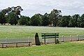 A cricket oval in Wallendbeen, New South Wales, with a white picket fence
